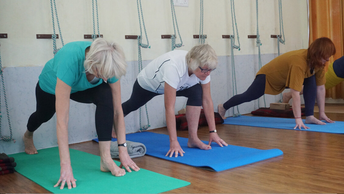 three women stretching yoga
